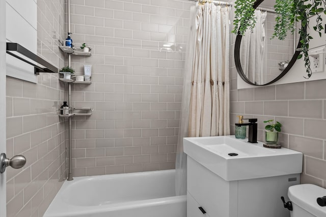 3520 Tryon Ave Unit 603, New York City, NY 10467 - bathroom featuring vanity, shower / bath combo, decorative backsplash, and tile walls