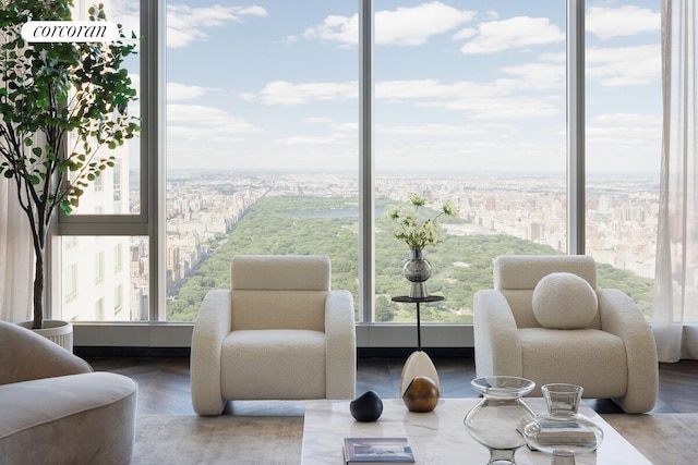 217 W 57th St Unit 82E, New York City, NY 10019 - sitting room with healthy amount of natural light, wood finished floors, and a view of city