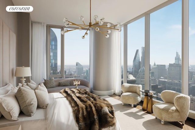 217 W 57th St Unit 82E, New York City, NY 10019 - bedroom with a skyline view and a chandelier
