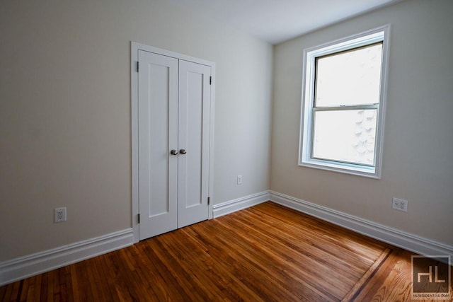 160 E 3rd St Unit 2F, New York City, NY 10009 - unfurnished bedroom with wood finished floors and a closet