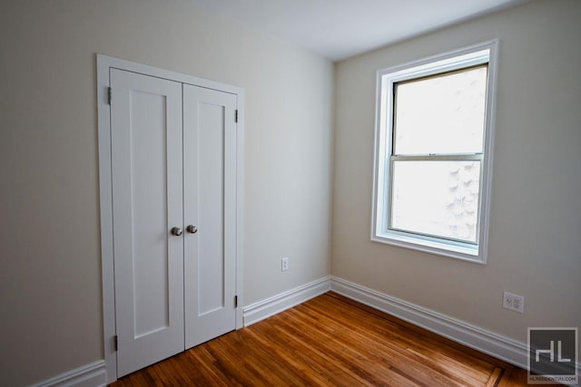 160 E 3rd St Unit 2F, New York City, NY 10009 - unfurnished bedroom with wood finished floors and a closet