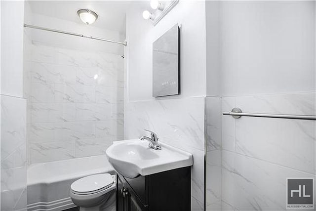 160 E 3rd St Unit 2F, New York City, NY 10009 - bathroom featuring vanity,  shower combination, and tile walls