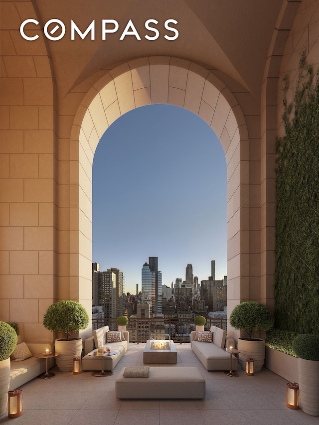 255 E 77th St Unit 3D, New York City, NY 10075 - view of patio featuring an outdoor fire pit and a skyline view