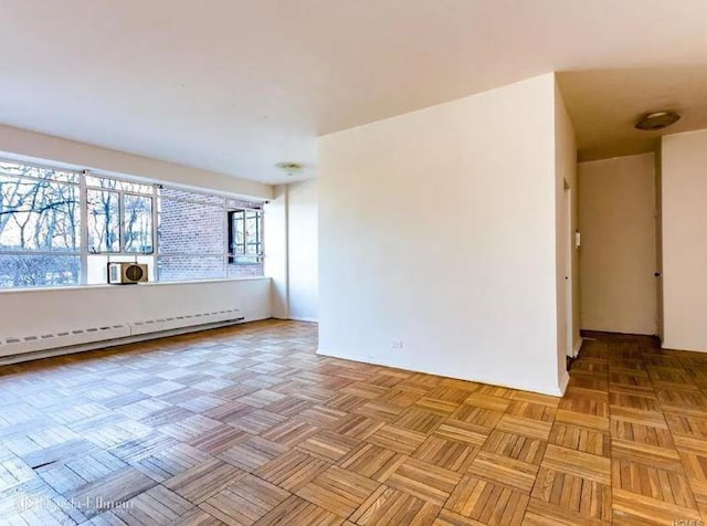2727 Palisade Ave Unit 4L, New York City, NY 10463 - spare room featuring a baseboard radiator