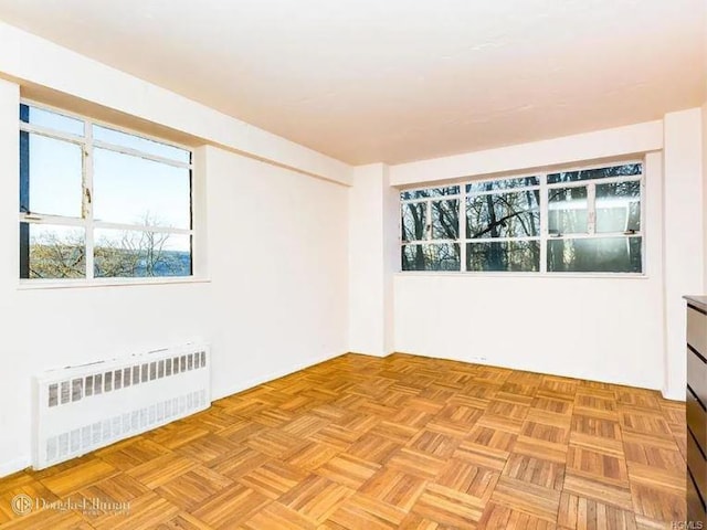 2727 Palisade Ave Unit 4L, New York City, NY 10463 - spare room featuring radiator and healthy amount of natural light