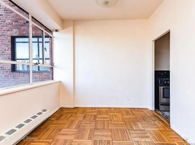 2727 Palisade Ave Unit 4L, New York City, NY 10463 - spare room with a baseboard heating unit and baseboards