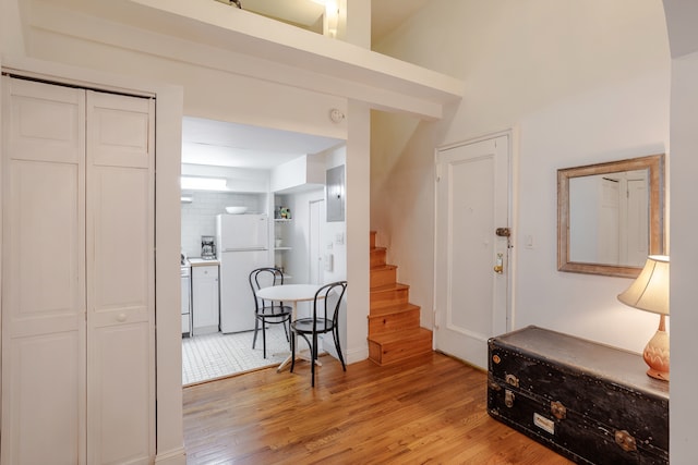 274 E 10th Street Multifami, New York City, NY 10009 - foyer entrance featuring light wood finished floors, stairs, and electric panel