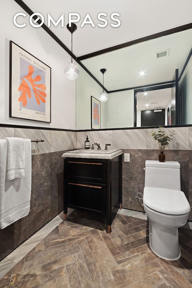 51 Jay St Unit 5J, New York City, NY 11201 - bathroom featuring tile walls, vanity, and a wainscoted wall