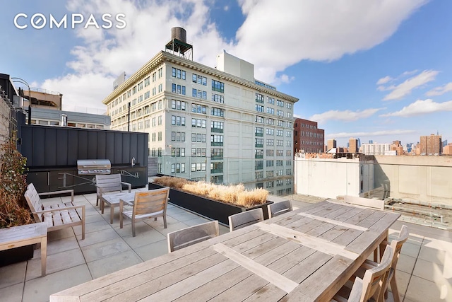 51 Jay St Unit 5J, New York City, NY 11201 - view of patio featuring area for grilling, a city view, and outdoor dining space