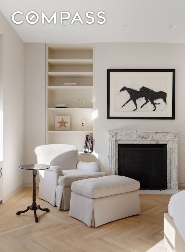 950 5th Ave Unit 3/4, New York City, NY 10075 - living area featuring built in features and a high end fireplace
