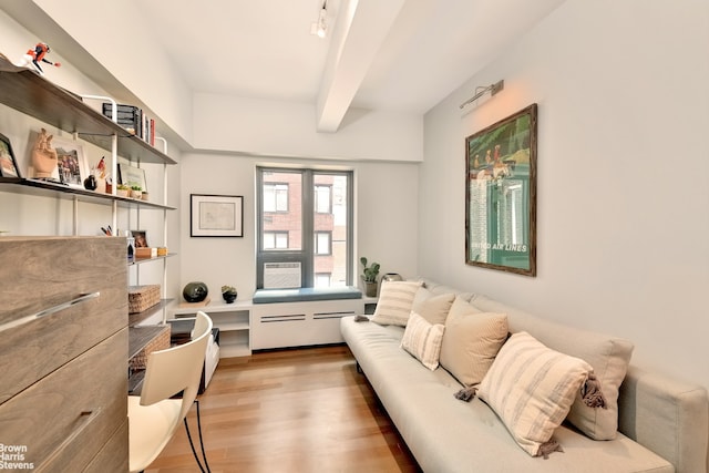 39 W 67th St Unit 1503, New York City, NY 10023 - living room with beamed ceiling, light wood-type flooring, and built in desk
