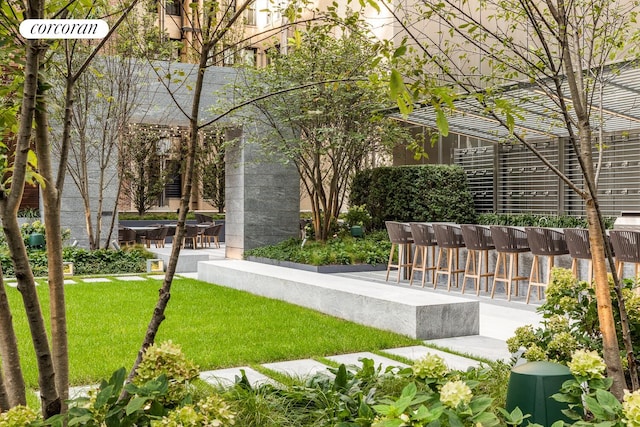 217 W 57th St Unit 84W, New York City, NY 10019 - view of community featuring a lawn and a patio area