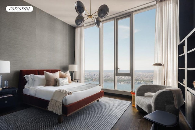 217 W 57th St Unit 84W, New York City, NY 10019 - bedroom featuring wood finished floors and wallpapered walls