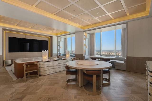 157 W 57th St Unit 64, New York City, NY 10019 - dining area featuring coffered ceiling, wainscoting, and ornamental molding