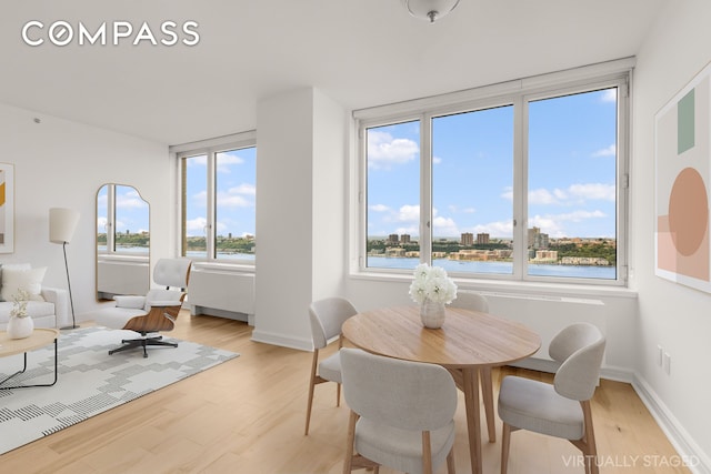 100 Riverside Blvd Unit 29C, New York City, NY 10069 - dining space featuring light wood-style floors and a water view