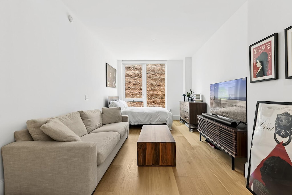 368 3rd Ave Unit 5E, New York City, NY 10016 - bedroom featuring light wood finished floors