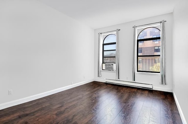51 W 131st St Unit 4-A, New York City, NY 10037 - spare room with a baseboard heating unit, plenty of natural light, and dark wood-style floors