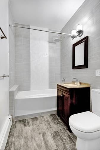 51 W 131st St Unit 4-A, New York City, NY 10037 - bathroom featuring vanity, shower / washtub combination, and wood finished floors