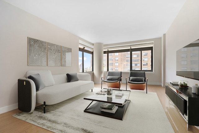 157 E 32nd St Unit 21B, New York City, NY 10016 - living room with healthy amount of natural light and wood finished floors