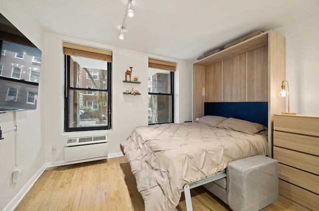 315 W 55th St Unit 1-D, New York City, NY 10019 - bedroom featuring light wood-type flooring and track lighting