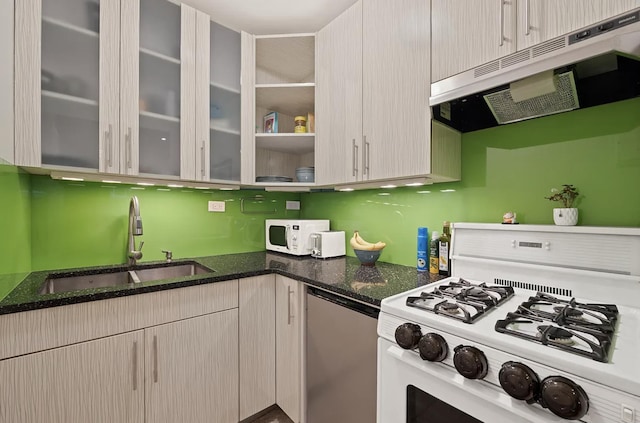 315 W 55th St Unit 1-D, New York City, NY 10019 - kitchen featuring extractor fan, white appliances, dark stone counters, and glass insert cabinets