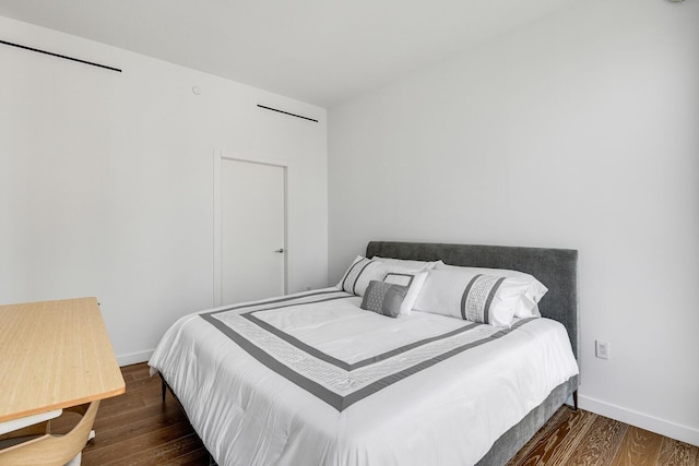 287 E Houston St Unit 4B, New York City, NY 10002 - bedroom featuring dark wood finished floors and baseboards