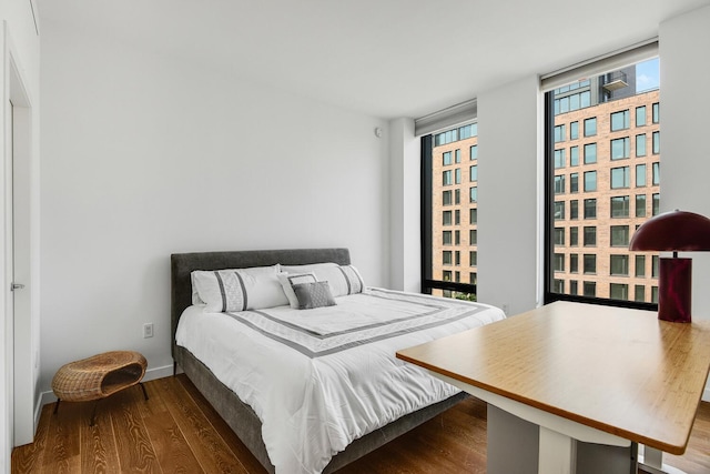 287 E Houston St Unit 4B, New York City, NY 10002 - bedroom featuring wood finished floors and baseboards