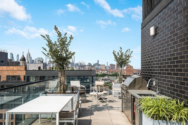 287 E Houston St Unit 4B, New York City, NY 10002 - view of patio with a view of skyline and area for grilling