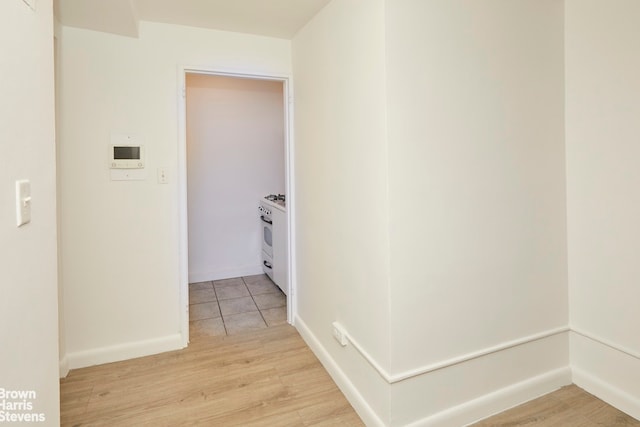 345 E 54th St Unit C, New York City, NY 10022 - hallway featuring light wood finished floors and baseboards