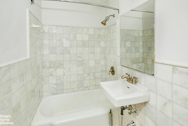 345 E 54th St Unit C, New York City, NY 10022 - full bath featuring tile walls and washtub / shower combination
