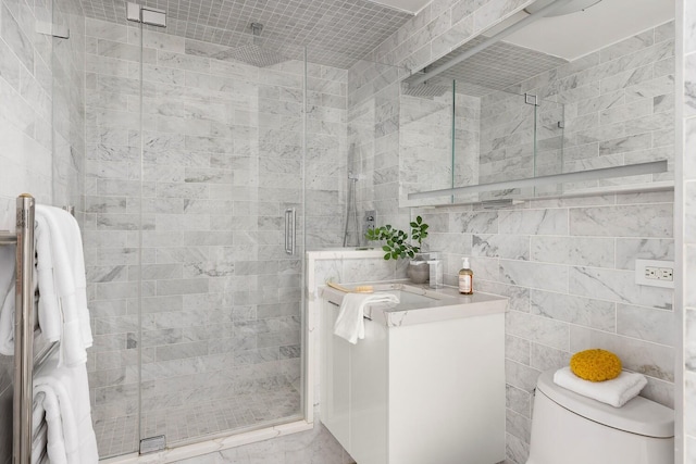 1965 Broadway Unit 8K, New York City, NY 10023 - bathroom with tile walls, vanity, a stall shower, and marble finish flooring
