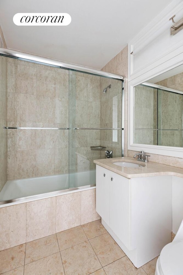 1965 Broadway Unit 8E, New York City, NY 10023 - full bath featuring tile patterned floors, tiled shower / bath combo, and vanity