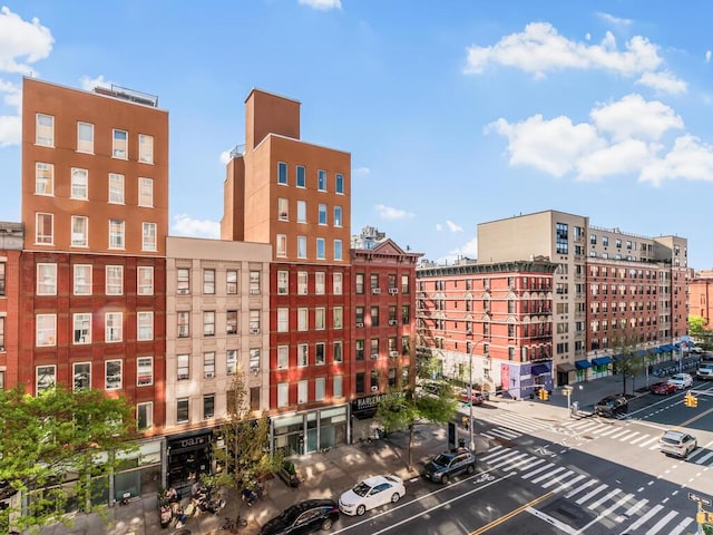 301 W 118th St Unit 7-H, New York City, NY 10026 - view of building exterior with uncovered parking and a view of city