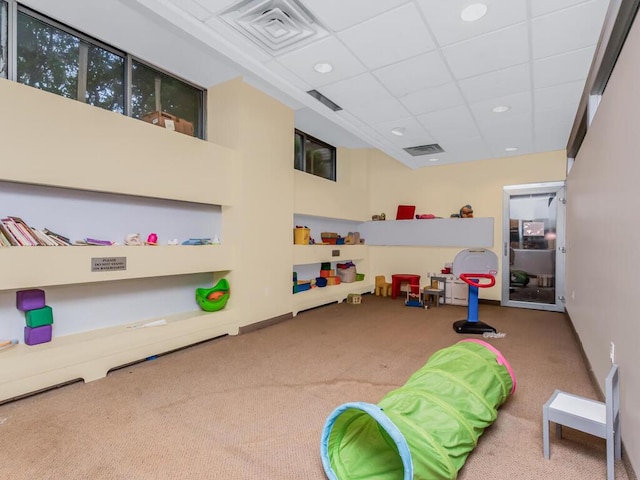 301 W 118th St Unit 7-H, New York City, NY 10026 - recreation room featuring carpet, a paneled ceiling, and recessed lighting