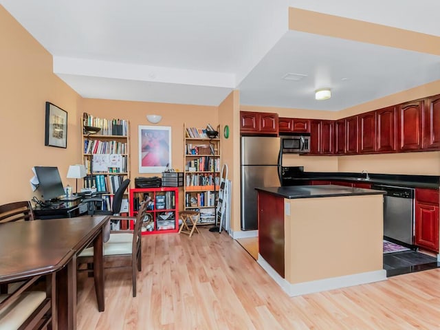 301 W 118th St Unit 7-H, New York City, NY 10026 - kitchen featuring appliances with stainless steel finishes, dark brown cabinets, and light wood-type flooring