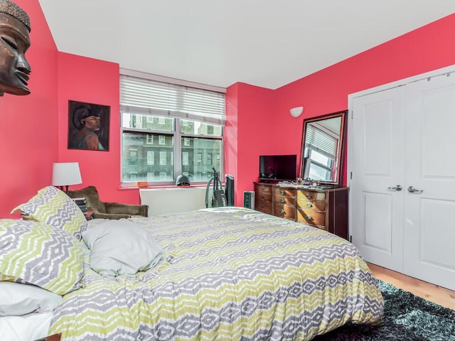 301 W 118th St Unit 7-H, New York City, NY 10026 - bedroom featuring wood finished floors and a closet