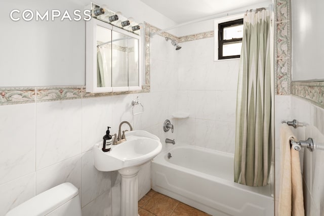 328 Sterling Pl Unit 1A, New York City, NY 11238 - bathroom with tile walls, shower / bath combination with curtain, tile patterned flooring, and wainscoting