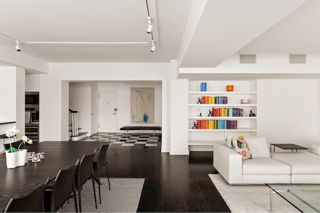 923 5th Ave Unit 12E/11, New York City, NY 10021 - living room with rail lighting, stairway, hardwood / wood-style floors, and built in features
