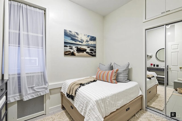 531 E 83rd St Unit 2-A, New York City, NY 10028 - tiled bedroom featuring baseboards and a closet