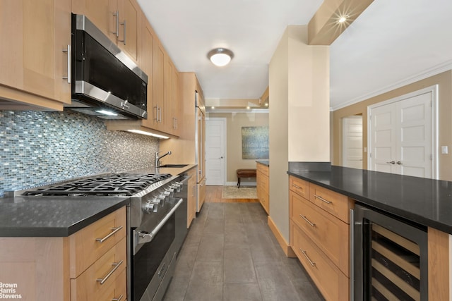 357 E 57th St Unit 3D, New York City, NY 10022 - kitchen with wine cooler, stainless steel appliances, light brown cabinets, dark countertops, and decorative backsplash