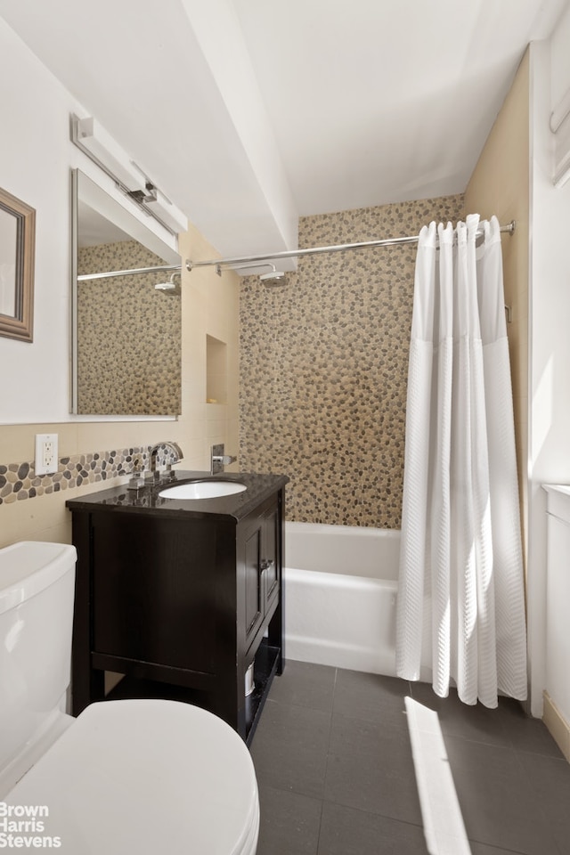 357 E 57th St Unit 3D, New York City, NY 10022 - full bath with shower / bath combo with shower curtain, tile patterned flooring, tile walls, and vanity