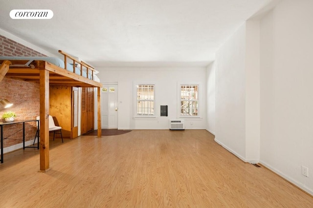 280 W 12th St Unit 1W, New York City, NY 10014 - unfurnished living room with wood finished floors and a wall unit AC