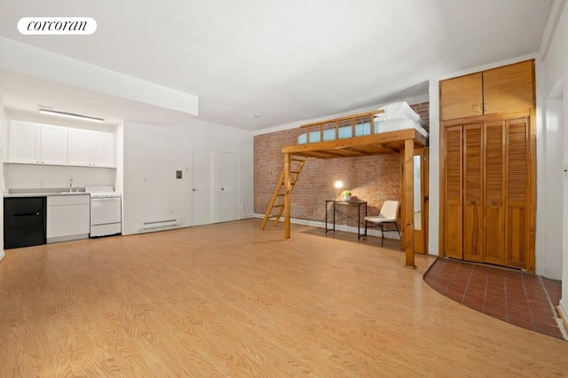 280 W 12th St Unit 1W, New York City, NY 10014 - unfurnished living room with brick wall, light wood-type flooring, baseboard heating, and bar with sink