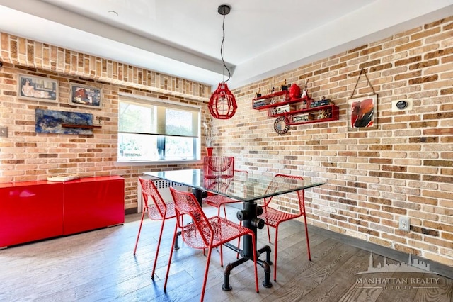 3567 Shore Pkwy Unit 4A, New York City, NY 11235 - dining space featuring brick wall and hardwood / wood-style floors