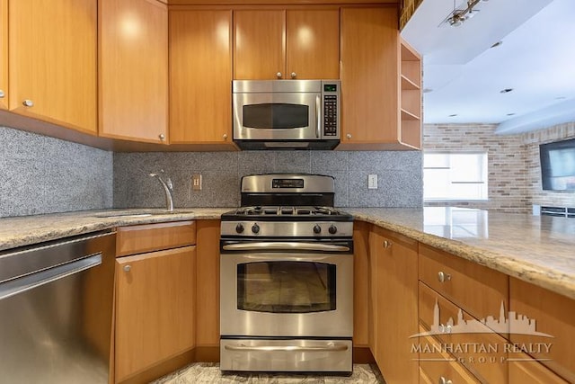 3567 Shore Pkwy Unit 4A, New York City, NY 11235 - kitchen with appliances with stainless steel finishes, decorative backsplash, light stone countertops, and open shelves