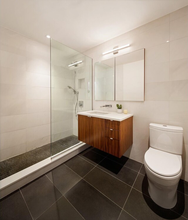496 Prospect Pl Unit 4, New York City, NY 11238 - bathroom with walk in shower, vanity, tile walls, and tile patterned flooring