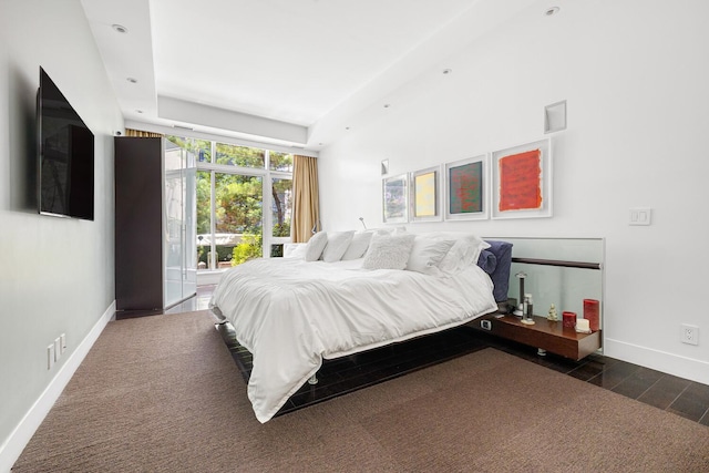 111 Fulton St Unit Ph111, New York City, NY 10038 - bedroom with dark wood-style flooring and a tray ceiling