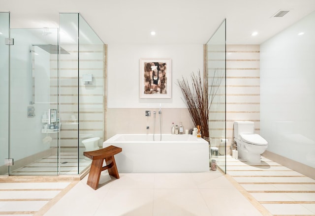 111 Fulton St Unit Ph111, New York City, NY 10038 - full bathroom with a freestanding bath, a stall shower, tile patterned floors, and recessed lighting