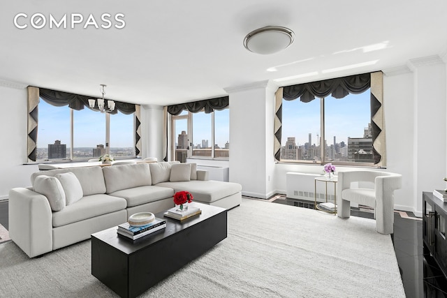 200 E 89th St Unit 34Cd, New York City, NY 10128 - living room with a view of skyline, a chandelier, and plenty of natural light