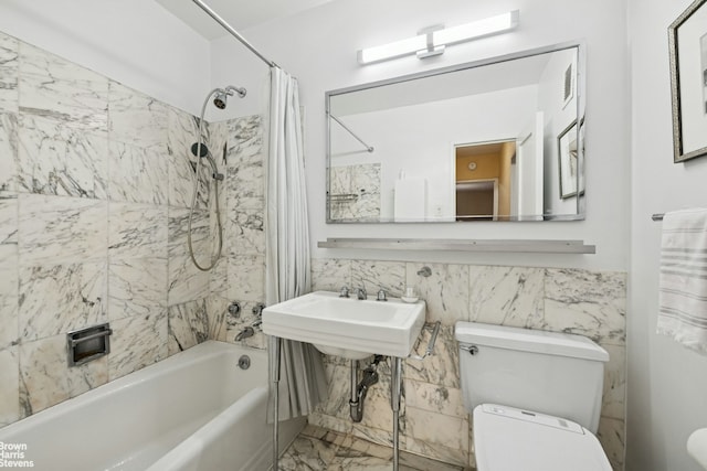 500 E 83rd St Unit 12C, New York City, NY 10028 - bathroom featuring shower / tub combo, tile walls, and marble finish flooring